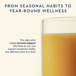 Glass of orange juice elixir with text about immune support and year-round wellness.