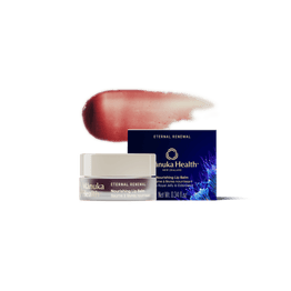 Manuka Health Eternal Renewal Nourishing Lip Balm packaging with a swatch of color on a white background.