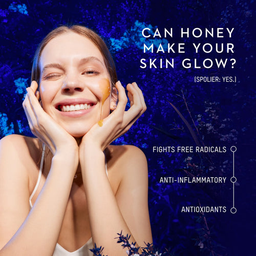Woman applying Manuka Health's Manuka  honey to her face with a blue floral background.