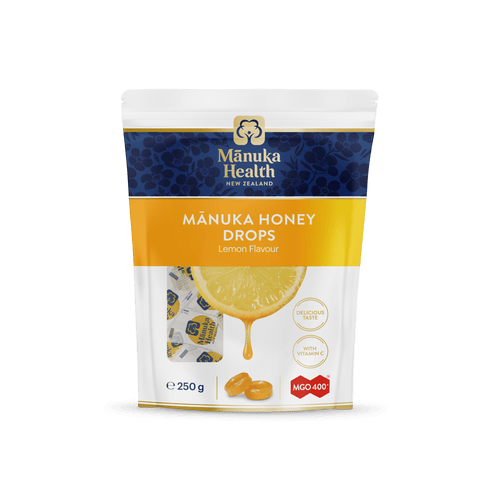 Manuka Health Manuka Honey Drops Lemon Flavor packaging on a green background