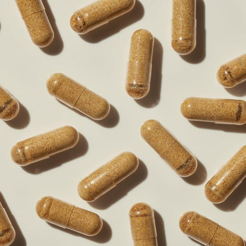 Pattern of Propolis capsules on a light beige background.